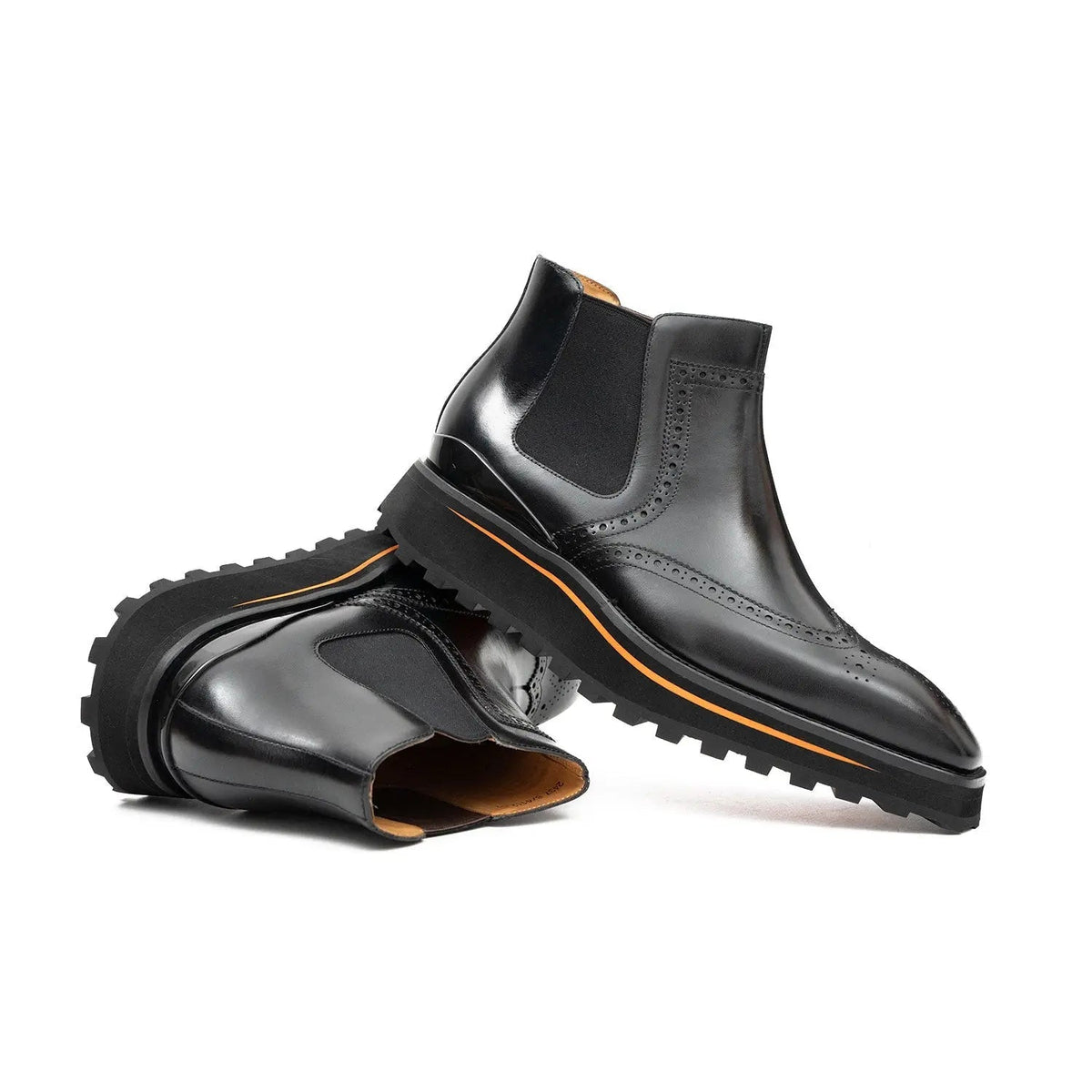 Black Wingtip Chelsea Boots with Brown-Edge Lug Sole