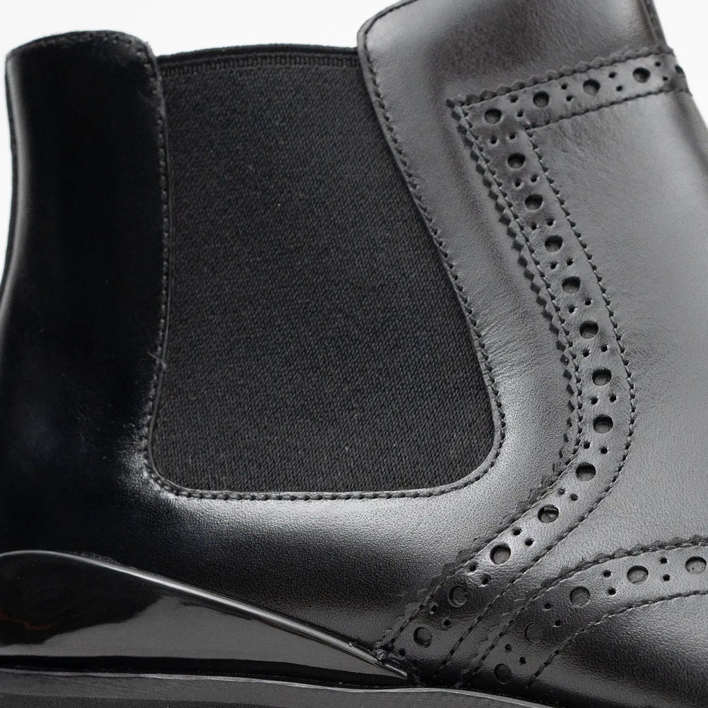 Black Wingtip Chelsea Boots with Brown-Edge Lug Sole