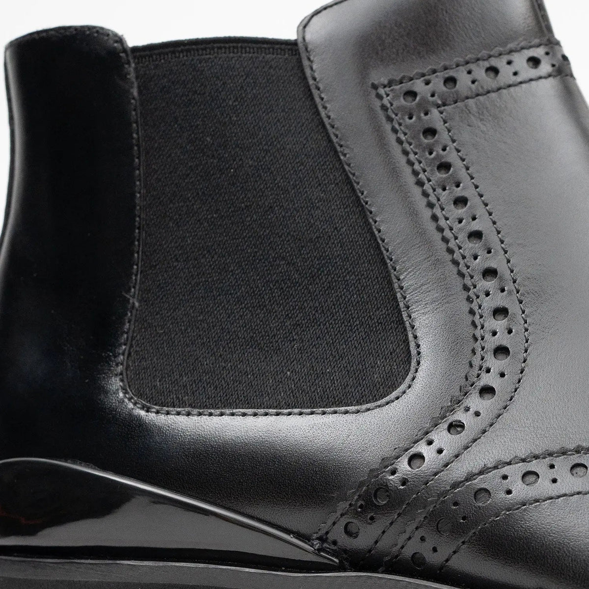 Black Wingtip Chelsea Boots with Brown-Edge Lug Sole