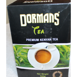 Dormans Premium Kenyan Tea 500g full black box front view with white teacup and tea garden imagery