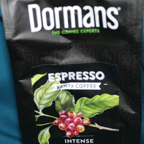 Front section of Dormans Espresso Kenya Coffee dark roast package close-up image