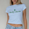 "Lucky Charm" Varsity St. Patrick's Day Baby Tee - Retro Collegiate 90s Aesthetic Top, Premium 100% Cotton Sporty St. Paddy's Shirt, Cute Lucky Charm Club Graphic Tee, Y2K Aesthetic Gift for Her, Soft Lived-In Green Clover Streetwear