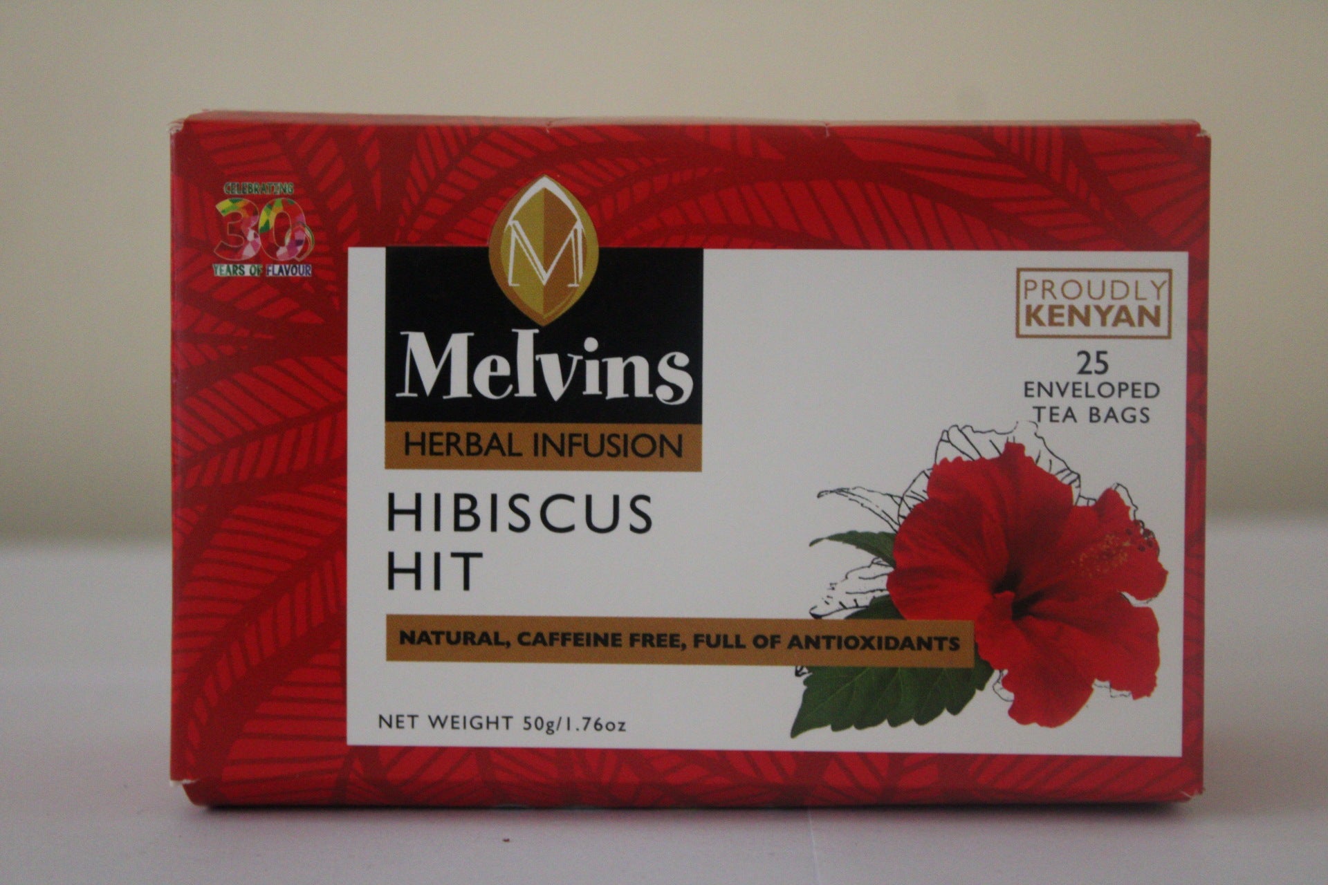 Melvins Hibiscus Hit herbal infusion red box three-quarter view showing front and side panels