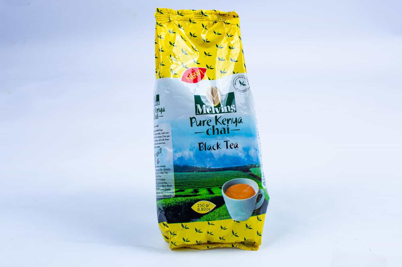 Melvins Pure Kenya Chai Black Tea 500g loose leaf bag front view with new badge and brewed tea cup on white background