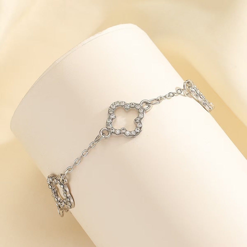 Inlaid Zircon Hollow Four-leaf Flower Three-piece Jewelry Set