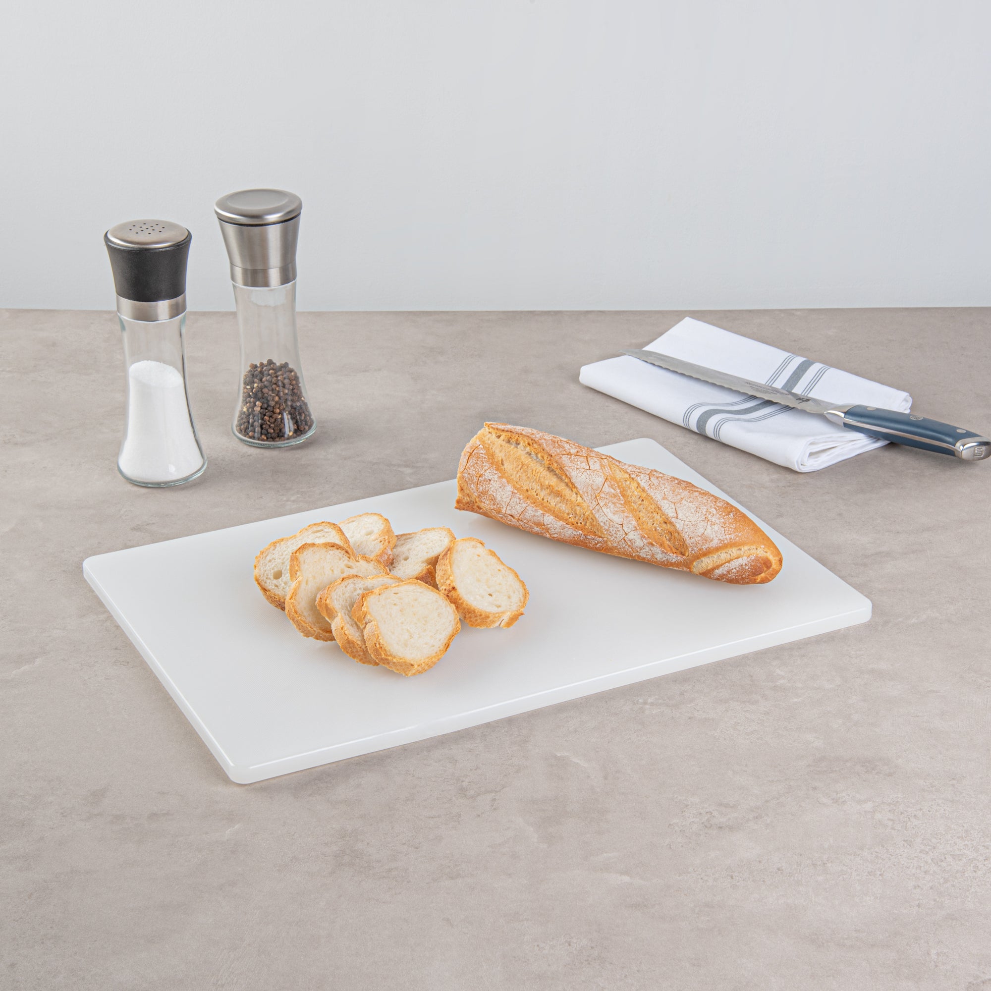 Chef 101 White Plastic Cutting Board - 18" x 12" x 1/2" - 10 count box