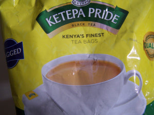 Ketepa Pride Kenya’s Finest black tea bags close-up with milk tea cup