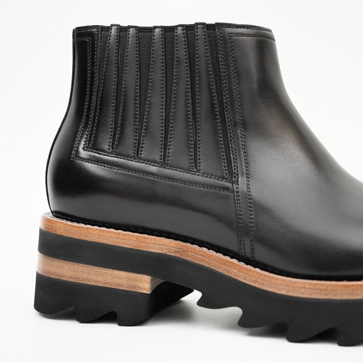Black Round-Toe Chelsea Boots with Ribbed Panels
