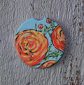 Car Coaster: Orange Ranunculus. Artist Christi Dreese