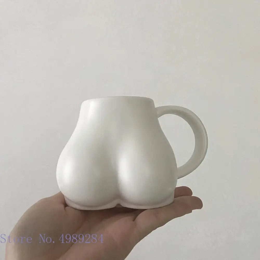 Playful white speckled butt shape ceramic coffee cup kitchen decor