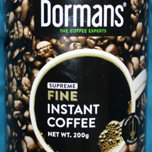 Dormans Fine Instant Coffee 200g metal coffee tin photographed as a clean e-commerce product image, featuring the Dormans The Coffee Experts logo, roasted coffee bean packaging artwork, Fine Instant Coffee label, white cup graphic, 200g net weight, circular quality roasting emblem, metallic silver edges, gold lower band, and isolated white background suitable for a Shopify coffee product page.