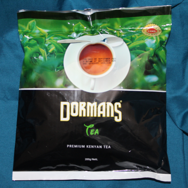 Front view of Dormans Premium Kenyan Tea 200g package showing tea cup image and brand logo