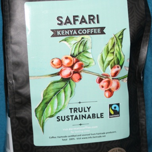 Detailed view of Dormans Safari Kenya Coffee label featuring coffee cherries, Kenyan coffee identity, and Fairtrade certification