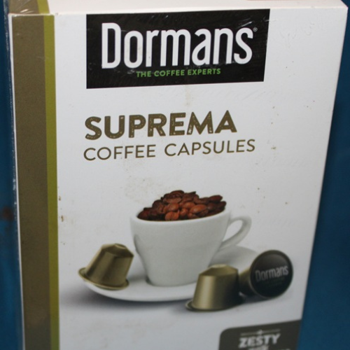 Close up of Dormans Suprema Coffee Capsules branding and premium coffee presentation