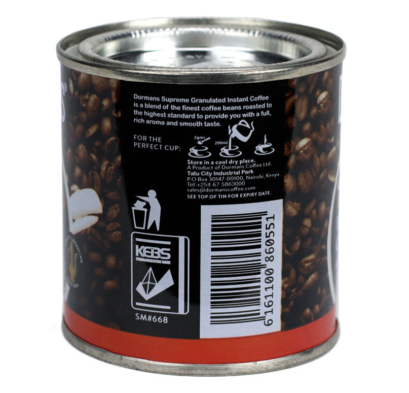 Back view of Dormans Supreme Granulated Instant Coffee 50g can showing product information, coffee preparation instructions, Dormans branding, Kenyan coffee packaging, granulated instant coffee details, manufacturer information, barcode, and 50g coffee packaging.