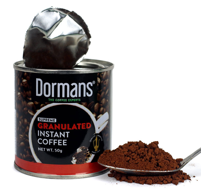 Dormans Supreme Granulated Instant Coffee 100g shown in an opened coffee can with granulated instant coffee visible inside, featuring Dormans branding, Kenyan coffee, Kenyan instant coffee, premium instant coffee, granulated coffee, coffee granules, and convenient 100g coffee packaging for home, office, travel, and everyday coffee preparation.