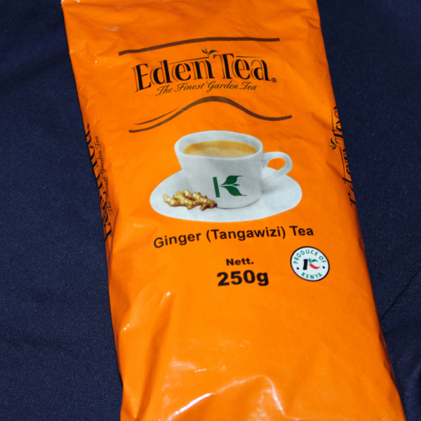 Large front close-up of Eden Tea Ginger Tangawizi Tea 250g pack showing tea cup and ginger image