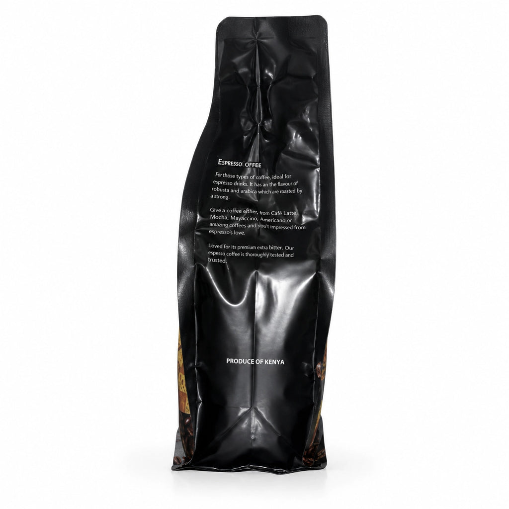 Espresso Coffee Kenya whole bean coffee packaging in a premium black stand-up pouch, shown from the rear with the white “ESPRESSO COFFEE” label and product description visible. The package describes coffee made from a Robusta and Arabica blend, suitable for espresso drinks including Café Latte, Mocha, Macchiato and Americano, with a strong roasted flavor and extra-bitter profile. The glossy black packaging has realistic folds and reflections, coffee bean graphics along the lower sides, and “PRODUCE OF KENYA