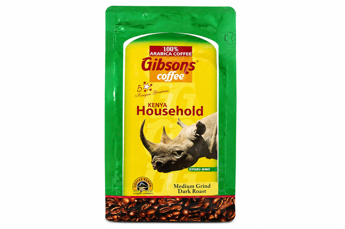 A package of Gibson's Coffee Kenya Household medium roast dark roast coffee, featuring a green and yellow pouch with a rhinoceros graphic and a coffee bean pattern at the bottom. Gibsons Kenya Household Coffee 400g dark roast medium grind, 100% Arabica Kenyan coffee for everyday home brewing