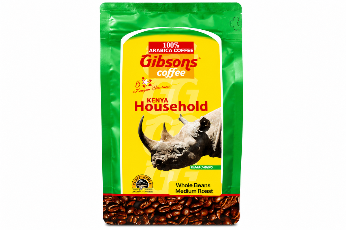A 1 kg bag of Gibson's Coffee Kenya Household Whole Beans Medium Roast, featuring a green and yellow packaging design with a rhinoceros graphic and coffee beans at the bottom. Gibsons Kenya Household Whole Bean Coffee 400g medium roast, 100% Arabica Kenyan coffee beans for everyday brewing