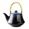 Glossy blue ceramic tea kettle set with bamboo handle dining room