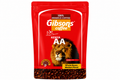A red stand-up pouch of Gibson's Coffee Kenya AA whole beans medium roast coffee, featuring a lion graphic and coffee beans at the bottom, on a white background.