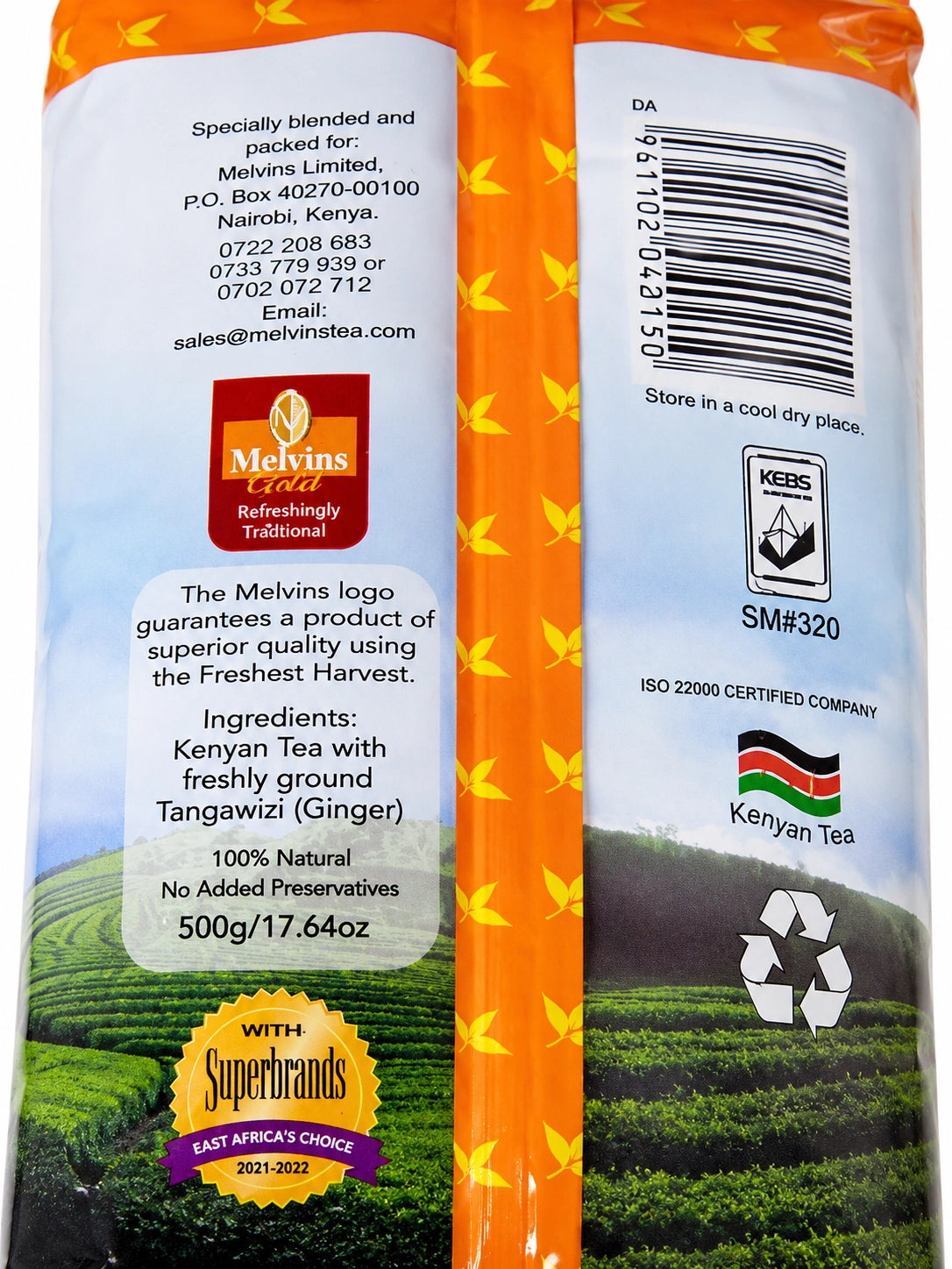 Back view of Melvins Tangawizi Chai 500g Kenyan ginger black tea packaging, showing product ingredients, freshly ground Tangawizi (ginger), 100% natural labeling, no added preservatives, 500g weight, Kenyan Tea branding, storage information, barcode, KEBS and ISO certification details, Superbrands recognition, and Kenyan tea plantation imagery.