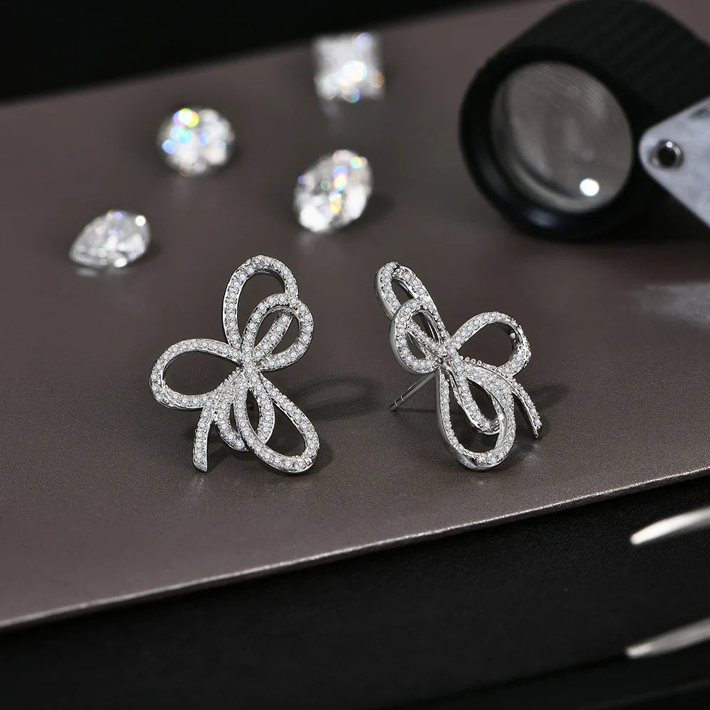 Open Bow Moissanite Stud Earrings in 925 Sterling Silver