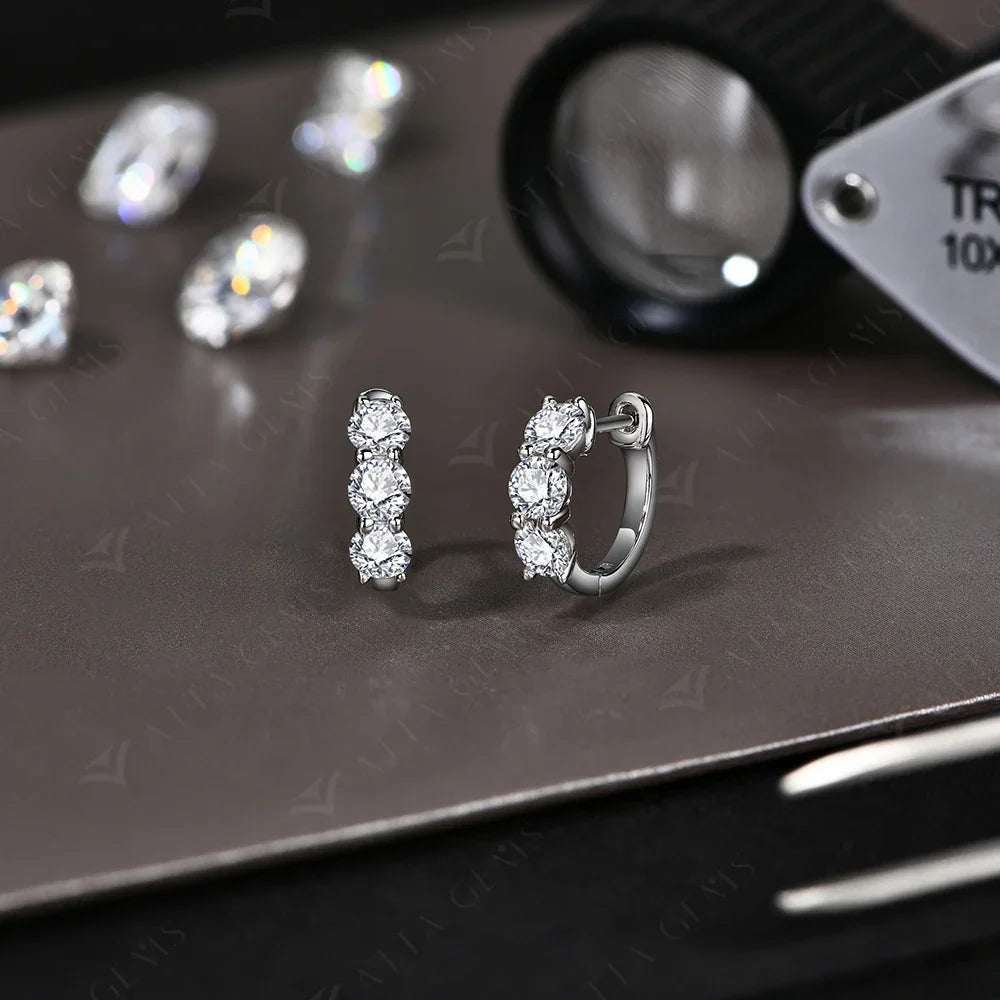 Graduated Three-Stone Moissanite Hoop Earrings in Sterling Silver