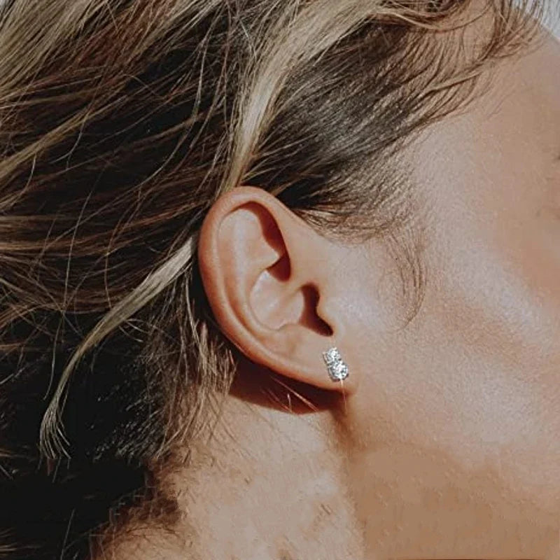Graduated Two-Stone Moissanite Stud Earrings in Sterling Silver