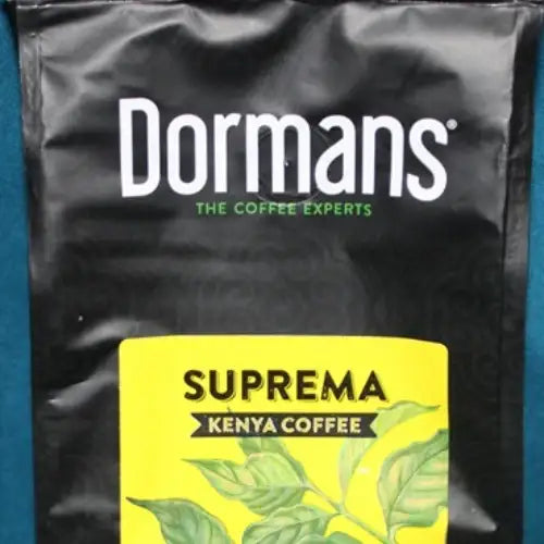 Medium grind coffee for French press brewing from Dormans Suprema, 375g of medium roast Kenyan coffee with a smooth well-rounded body, bright citrus notes, chocolate undertones, and sweet maple aroma. Dormans SUPREMA Kenya Coffee - Medium Roast Medium Grind 375g - World Safari Shops.